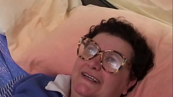 Image Horny old lady masturbates with a dildo at home