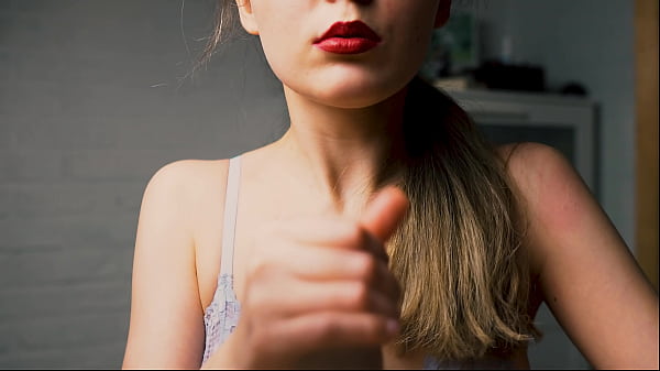 Image A beauty with red lips jerks off her boyfriend in close-up and brings him to the peak of pleasure.