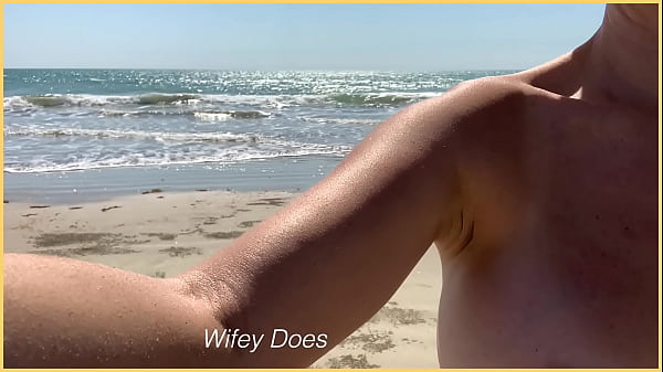 Image Wife walks around public beach fully nude