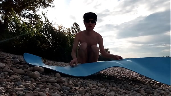 Image Slender nudist boy does yoga nude on a naturist beach. Naked yoga video by Jon Arteen gay porn model