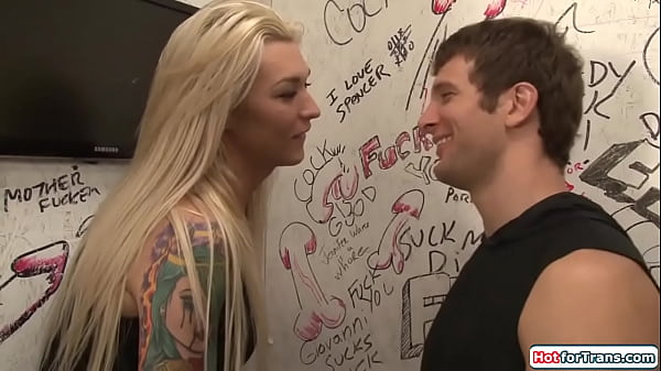 Image Two shemales one guy gloryhole blowjob