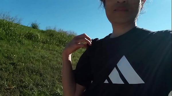 Image Freeballing twink walks without underwear, sticks out his soft dick from his very short shorts outdoor