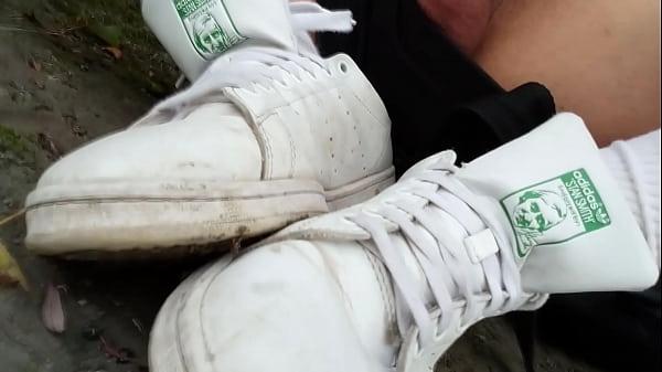 Image Caught making a porn video, Jon Arteen hides to film the masturbation and cum shot scene on his Adidas Stan Smith sneakers outside on a muddy riverbank
