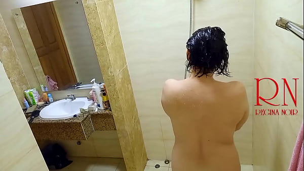 Image Shower. Voyeur camera. Nude Regina Noir in the shower washes and rubs with oil. 2