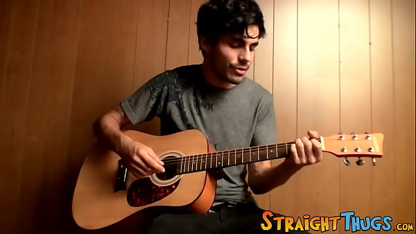 Image Handsome young man enjoys his guitar and jerkoff solo