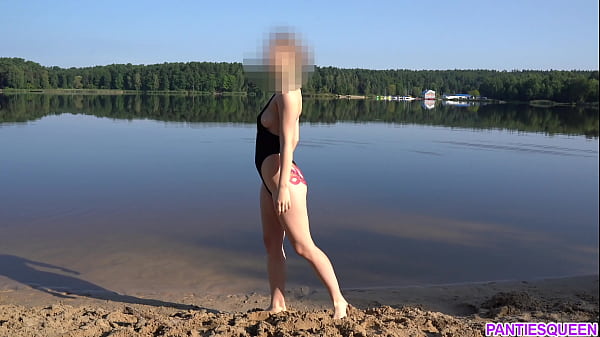 Image Naked girl goes skinny dipping in public beach