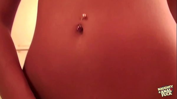 Image Blonde girl in skimpy outfit and pierced belly masturbates with fingers and dildo on bed