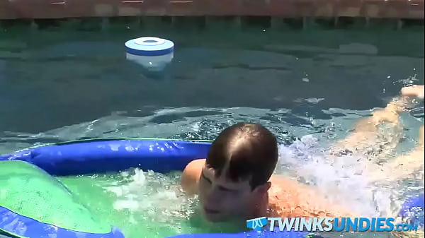 Image Cute young twink Patrick Kennedy stokes cock by the pool