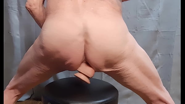 Image busy-bottom sits on another Dildo