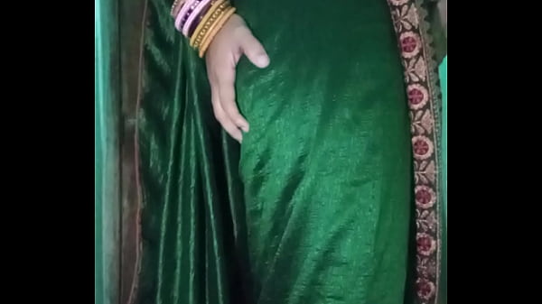 Image Indian gay Crossdresser Gaurisissy in Green Saree pressing her big Boobs and fingering in her ass