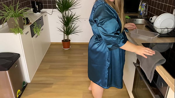 Image Sexy Stepmother-in-law in a silk robe pees in the kitchen for her son-in-law