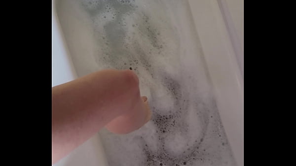 Image petite slut masturbates in the bath POV