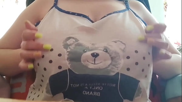 Image Young student with big tits excites her big nipples . Close-up