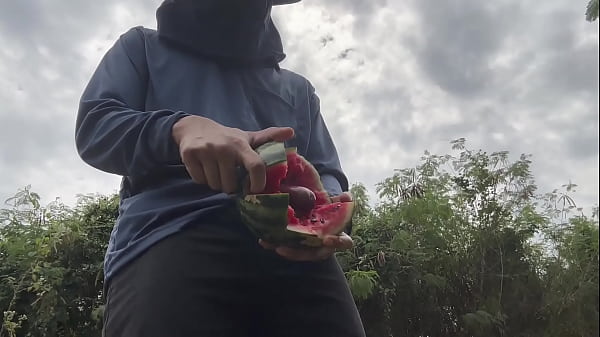 Image Worker cum with watermelon.