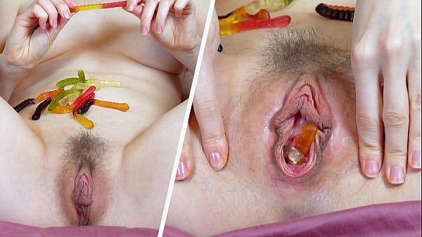 Image Neighbour is preparing cummy gummies by inserting candies in pussy and butthole for flavour