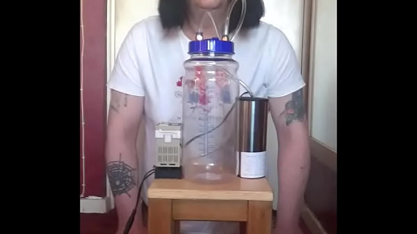 Image bisexual crossdresser with his portable cow milking machine