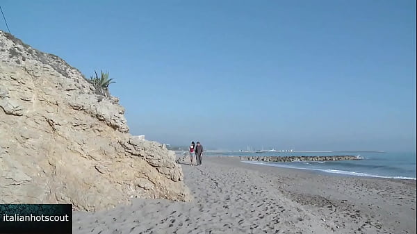 Image Very attractive brunette girl fucking on the beach with a hot male