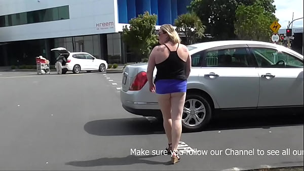 Image NZ Trashy slut pisses in the bus stop in front of traffic and the public before showing off in the carpark