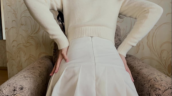Image Girl in a white skirt masturbates with a vibrator