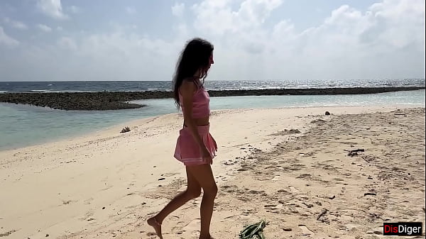 Image Katty pees powerfully on the beach and I give her golden shower on her face