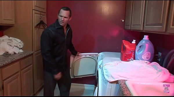 Image A guy dominates a busty blonde who is chained up in the bathroom