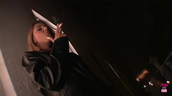 Image A blonde in leather is double penetrated by a man with a strapon until cumshot