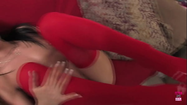 Image A naughty brunette angel in a Santa Claus costume banged a hung stud