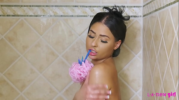 Image Tiny brunette takes a hot shower