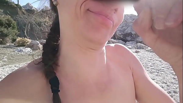 Image Brunette sucks a stranger's cock on a wild beach and swallows his cum