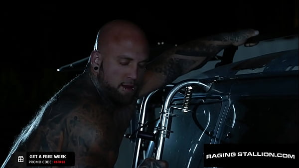 Image Beefy Trucker Drills Tatted Muscle Outdoors - RagingStallion