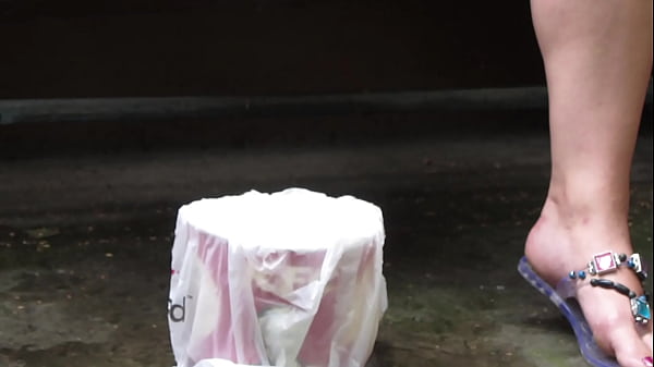 Image Gorgeous outdoor pissing. A plump milf smokes a cigarette and urinates while sitting on a bench on the street. Amateur fetish.