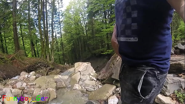 Image I piss in a mountain stream and then feel like jerking off my cock, despite the risk of getting caught. Outdoor fun in Nature. (S)