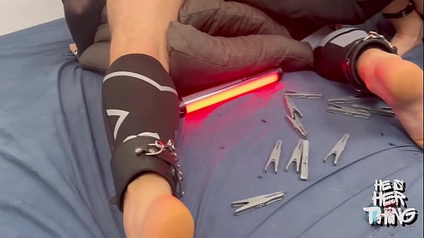 Image Mistress Straps Her Slave's Hands to His Legs and Punishes Him