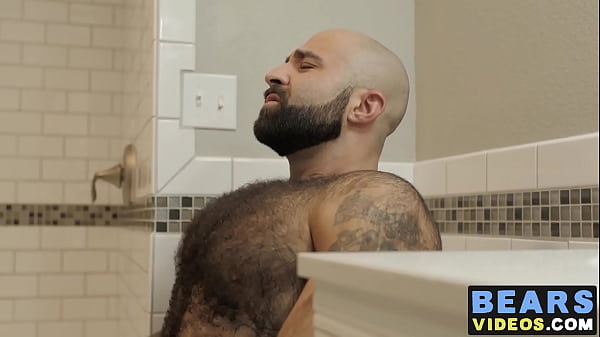 Image Bear washes his furry body and spanks his thick monkey