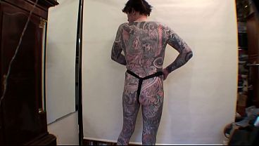 Image Tattoo Boy LeeHarper Pinnomen Show Off With a Borrowed Fancy Tight Beltstrap used in the Male Stripshow Production - Two Rings are Attached to the Strap - Enabling a Stripper With a P/A to Suspend His