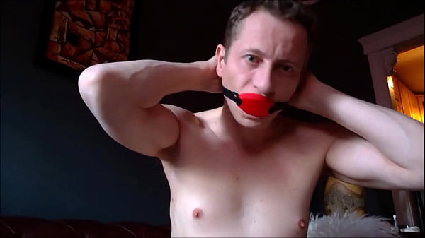 Image Gagged and cumming on the floor in bondage chains