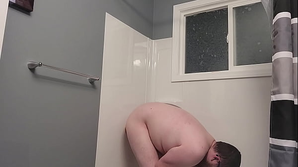 Image Bitchboy bondaged and fucks self in shower