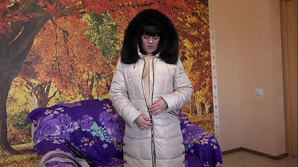 Image Milf in a down coat, in a hood with fur trim sucks a big dildo in different positions. Amateur fetish.