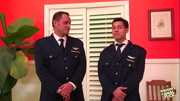 Image Two pilots share a blonde sexy milf and fill her mouth with cum after double penetration
