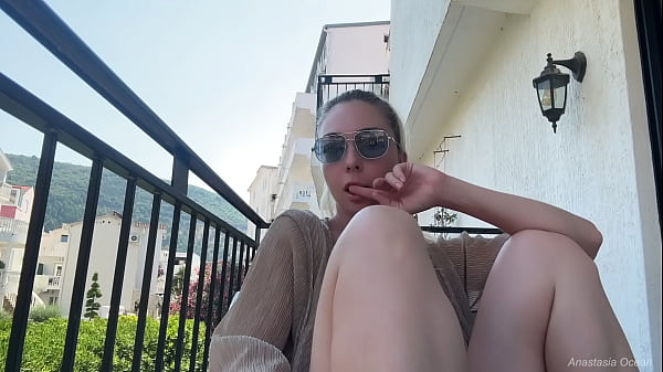 Image Flash and nudity on the balcony. Natural boobs in public.