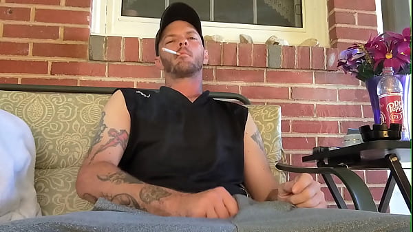 Image Smoking and stroking my BWC outside on the porch as your walking by