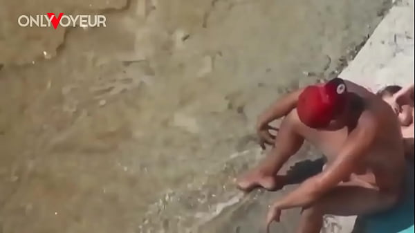 Image Beach Voyeur. Super horny teen getting off right on the nude beach