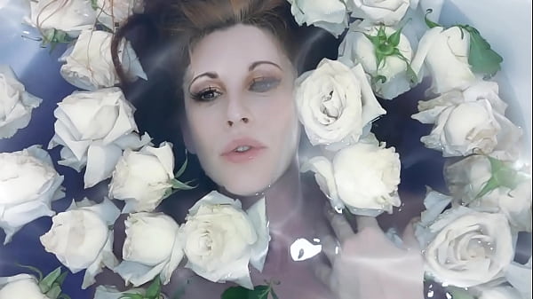Image Mesmerizing teasing in water ( bath with roses)
