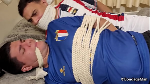 Image Two football player boyfriends are captured and tied and gagged together | PREVIEW