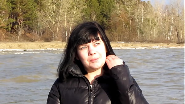 Image Cute milf smokes a cigarette and shows her naked pussy with a dildo inside and her tits outdoors. Amateur fetish in a public place.