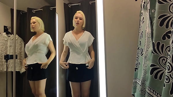 Image Seducing you in a fitting room. Sexy try on transparent clothes in the fitting room
