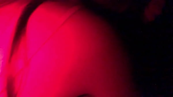 Image Masked in the red light sucking cock
