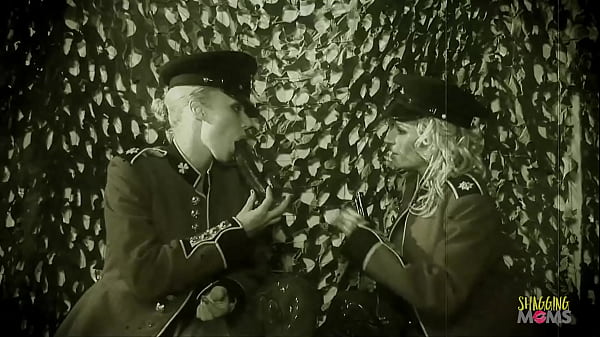 Image Bisexual women playing with a dildo engage in group sex with other soldiers