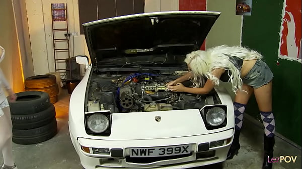 Image Twat worshiping lesbians take out their dildos at the car mechanic shop and pound their cunts together