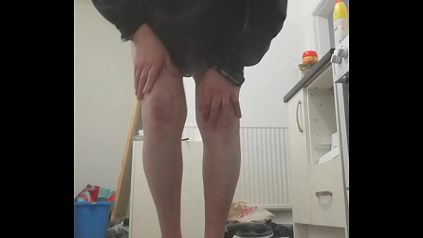 Image Pissing in kitchen, barefeet splashing, touching pussy with cock cage